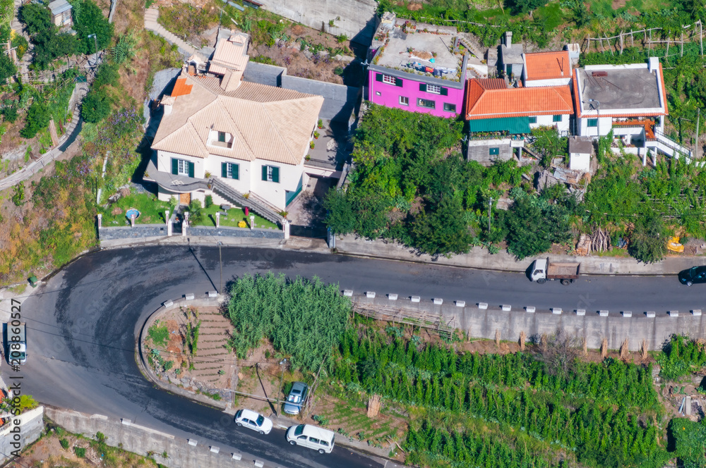 Aerial view of the road and the small village in the mountains. Madeira. Portugal Aerial view of the road and the small village in the mountains. Madeira. Portugal