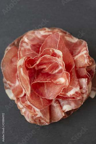 Italian prosciutto crudo or jamon. Raw ham. Top view