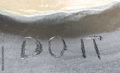 Fototapeta Naklejka Na Ścianę i Meble -  Words do it written on the river sand, conceptual text