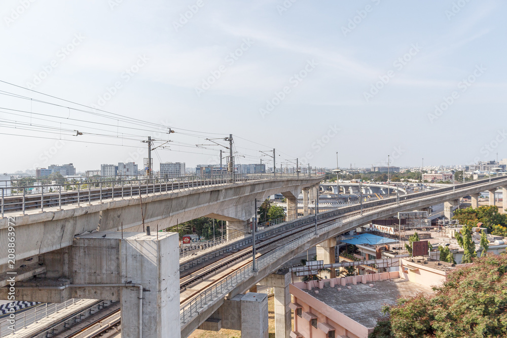 Chennai india may 27 2018 wide view of metro train bridge seen with nearby national highway road (known as kathipaara junction near guindy) Chennai india may 27 2018 wide view of metro train bridge seen with nearby national highway road (known as kathipaara junction near guindy)
