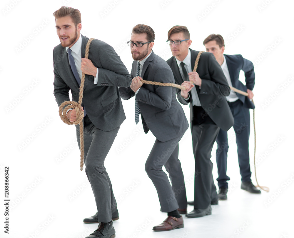 closeup.smiling business team pulls the rope. closeup.smiling business team pulls the rope.