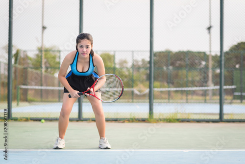 Woman playing tennis and waiting for the service © FocusStocker