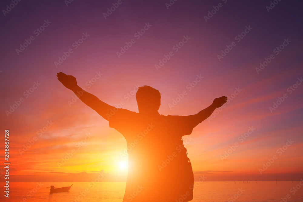 Silhouette of a man  in the beautiful sunrise.
