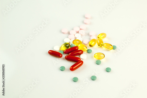 Top View of Many Colorful Pills Lying on White Background, Isolated. Medicine Concept.