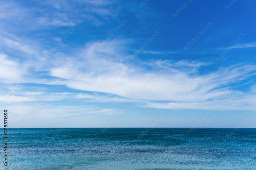 Calm sea and sky with clouds, background
