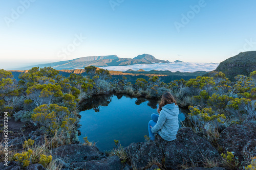 Girl admiring the Piton des Neiges in Reunion Island 