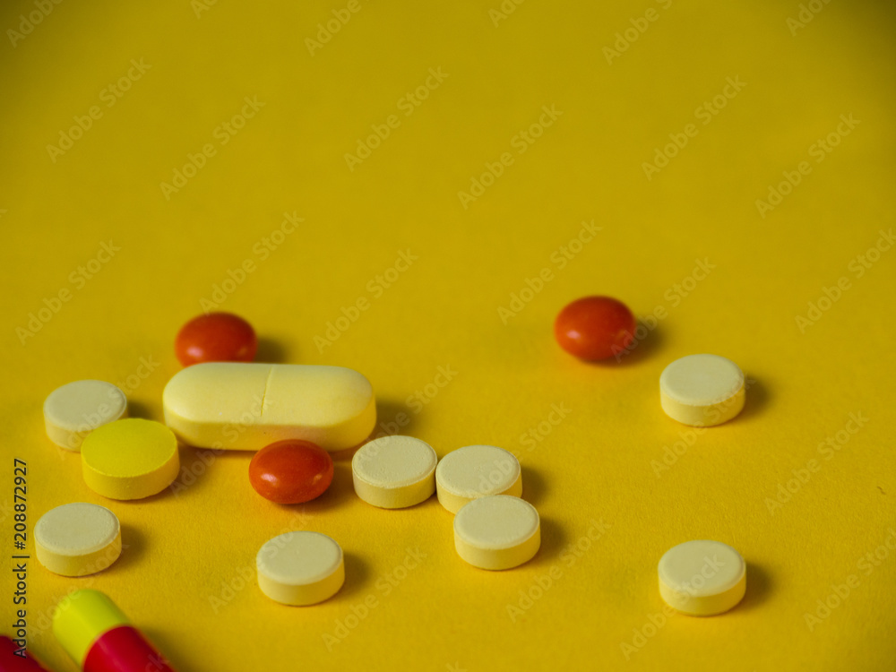 Tablets on a yellow background. Medicines. Tablets on a yellow background. Medicines.