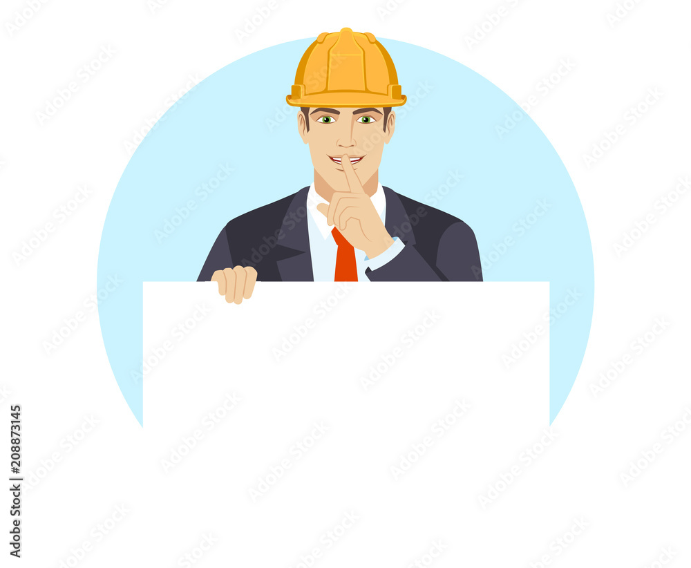 Businessman in construction helmet holding white blank poster and making hush sign Businessman in construction helmet holding white blank poster and making hush sign