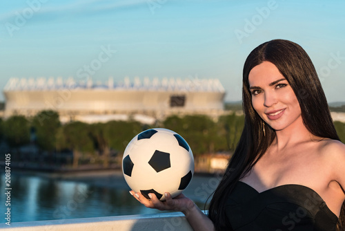 Pretty young model poses with football in Russia © Yakov