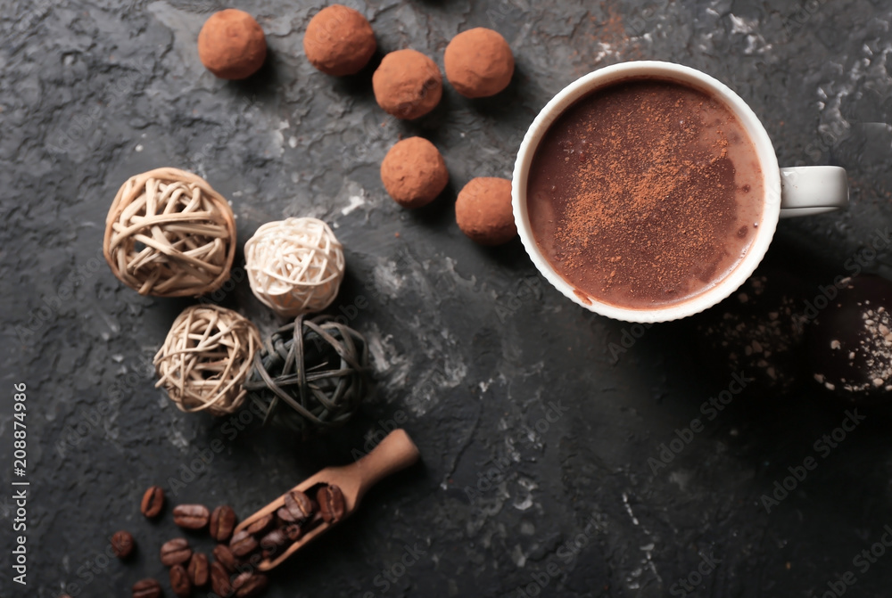 Cup of tasty hot chocolate and sweets on dark background Cup of tasty hot chocolate and sweets on dark background