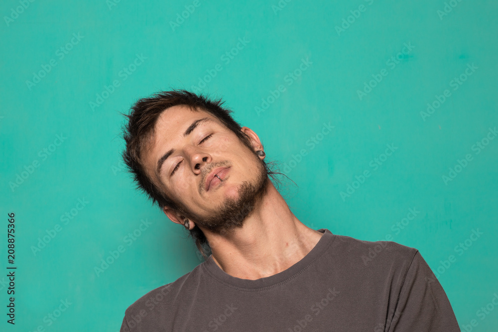 A modern bearded guy making a funny expression. A modern bearded guy making a funny expression.