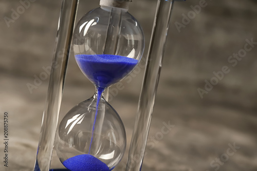 Hourglass on gray background. Time management concept