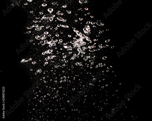 Bubbles of air in water on a black background