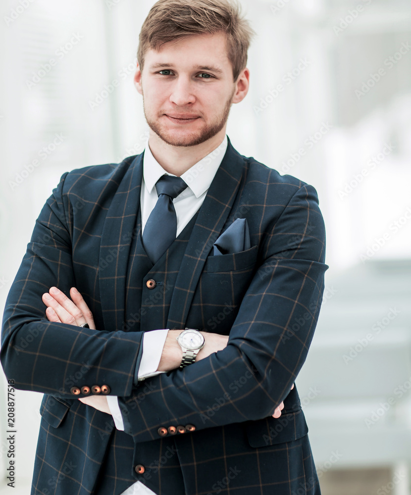 newcomer businessman in a business suit stands near the window newcomer businessman in a business suit stands near the window
