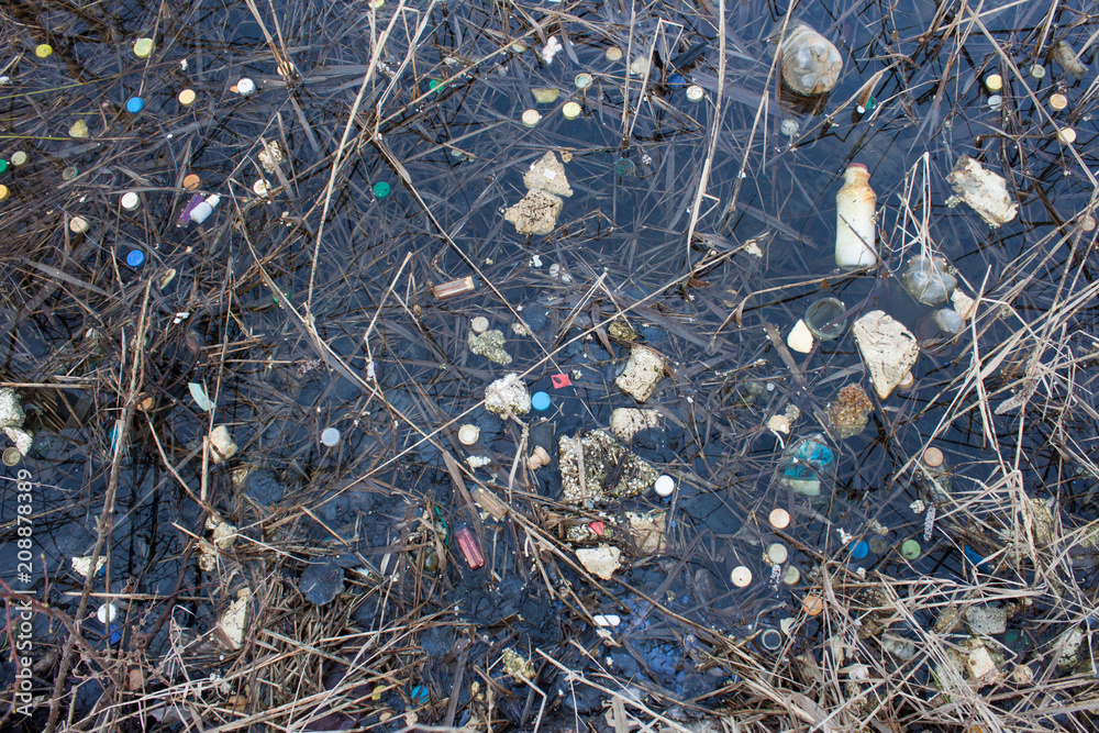 Plastic lids from bottles in the river