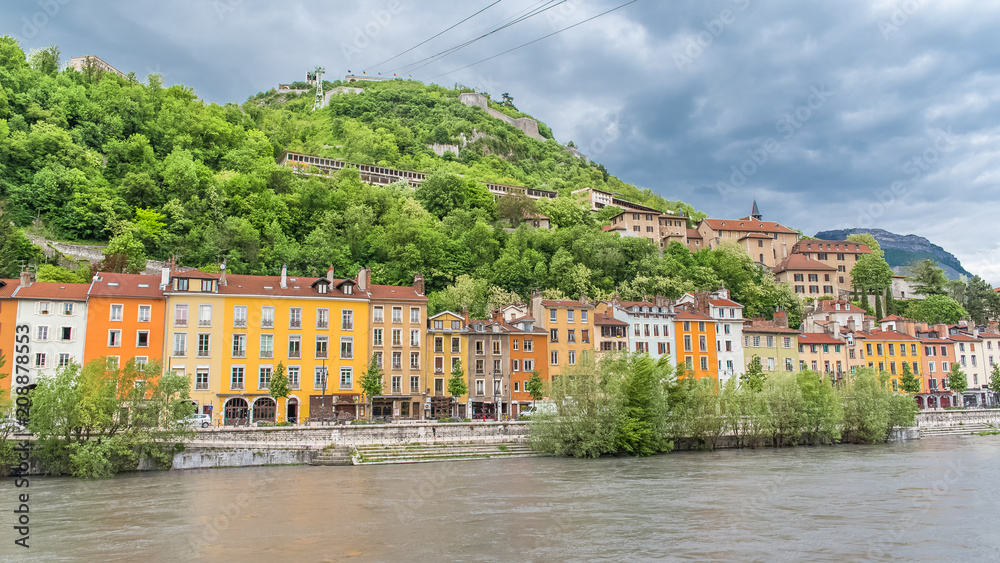 Grenoble, panorama of beautiful typical houses on the river Isere, in the center 
