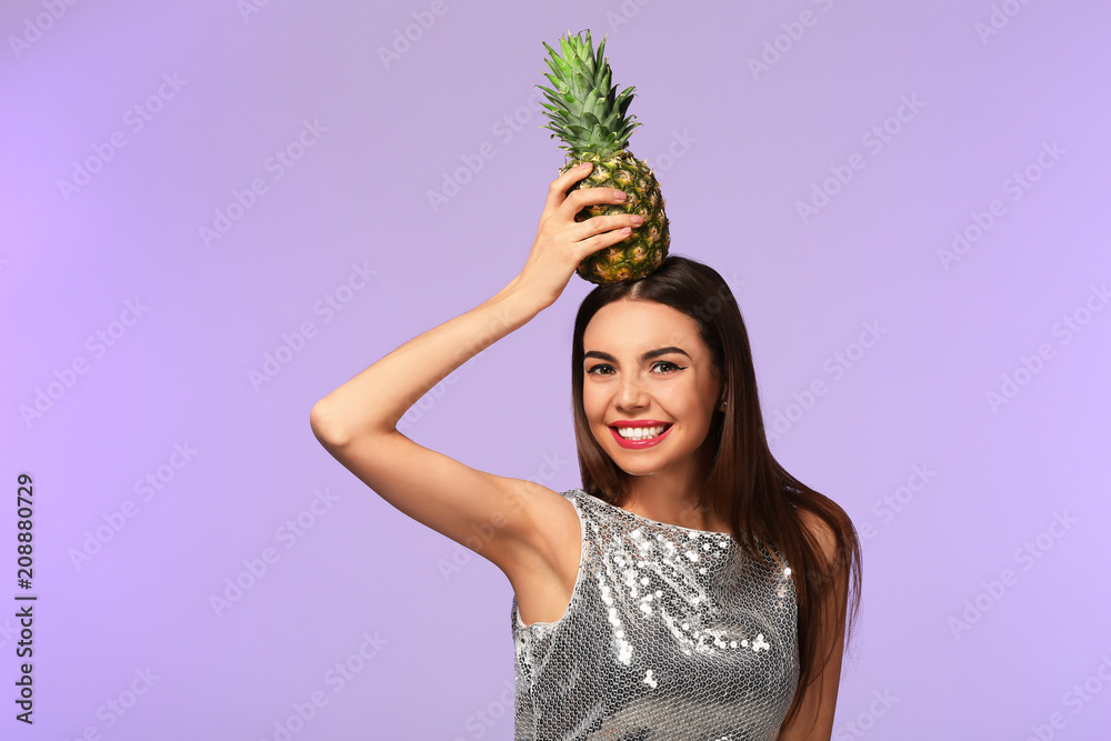 Attractive young woman with pineapple on color background Attractive young woman with pineapple on color background