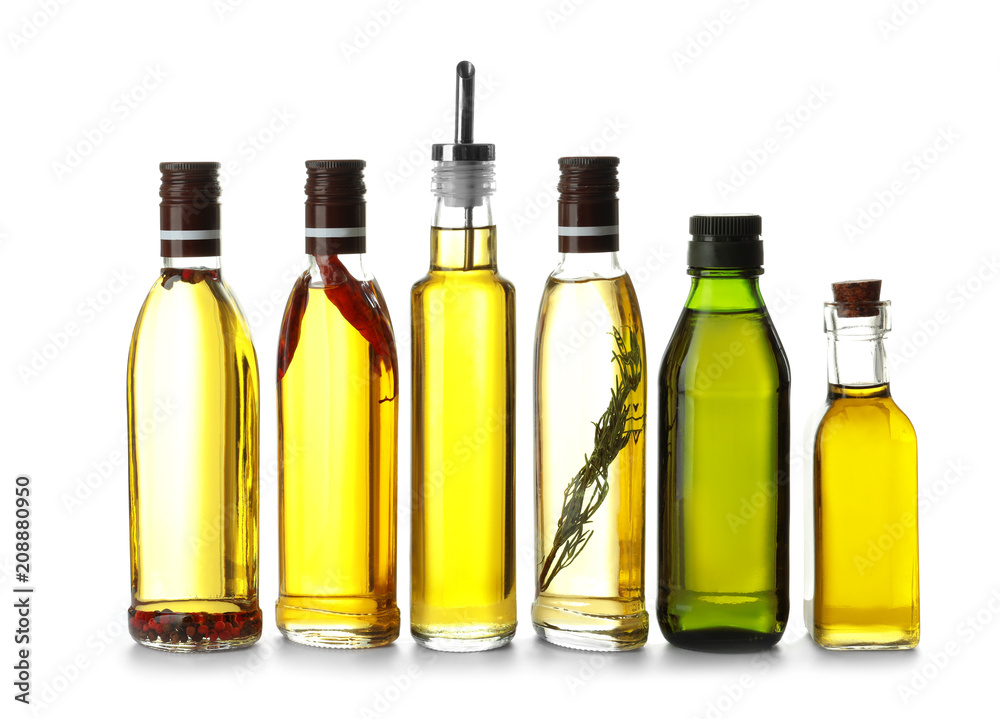 Glass bottles with olive oil on white background Glass bottles with olive oil on white background