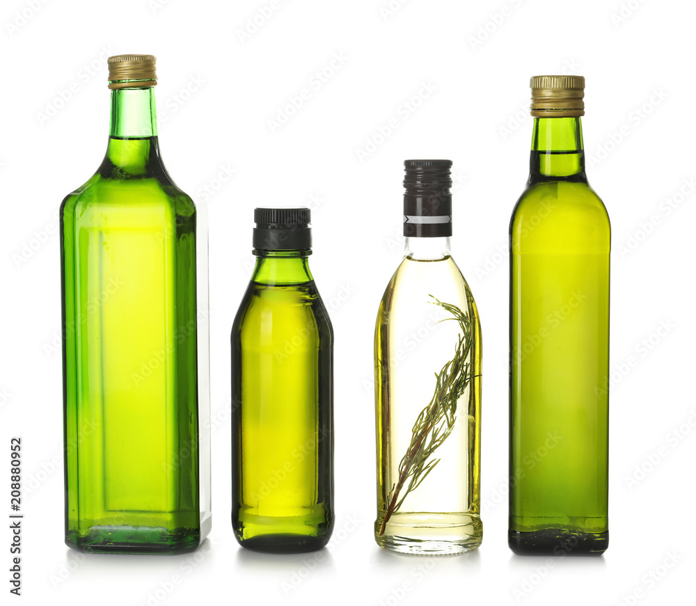Glass bottles with olive oil on white background Glass bottles with olive oil on white background