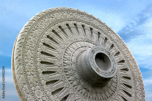 wheel of life or Dharmachakra of buddhism, Background blue sky for copy.