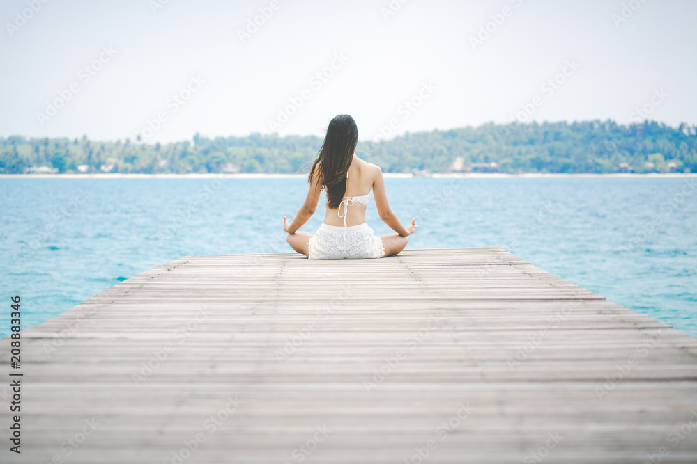 Woman meditation on bridge