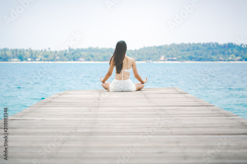 Woman meditation on bridge