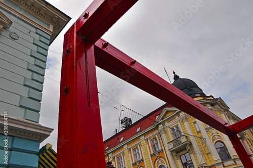 Contemporary art on the background of the old building photo