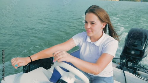 Wallpaper Mural Summer Vacation, Tourism. A Beautiful Young Girl Sails on a Motor Boat on the Lake Torontodigital.ca