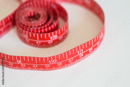 Red Measuring Tape Showing Inches and Centimeters