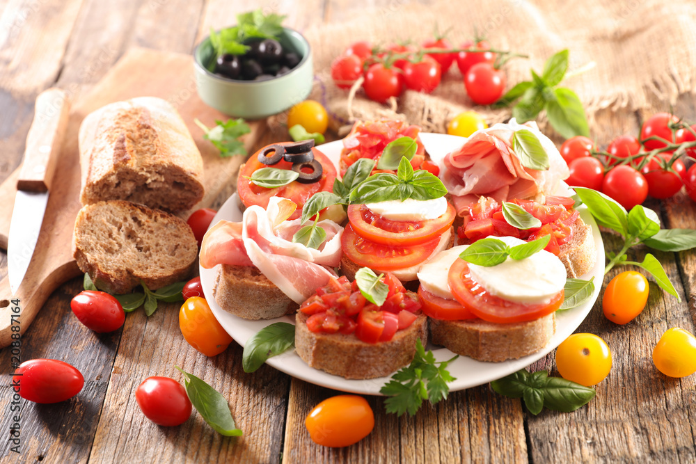 assorted bruschetta with tomato, mozzarella, olive assorted bruschetta with tomato, mozzarella, olive