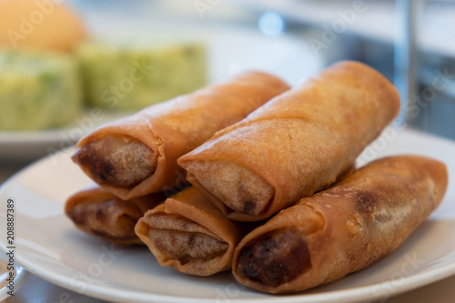 homemade deep fried spring rolls Chinese serving dish, selective focus