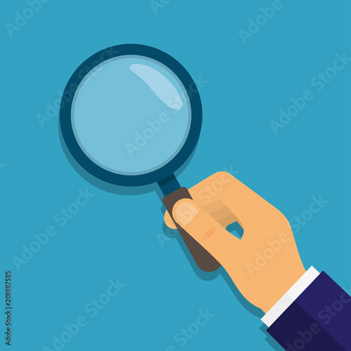 Hands with magnifying glass.