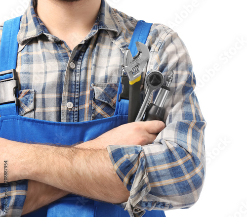 Male car mechanic with tools on white background, closeup
