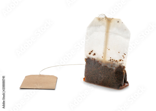 Used tea bag on white background photo