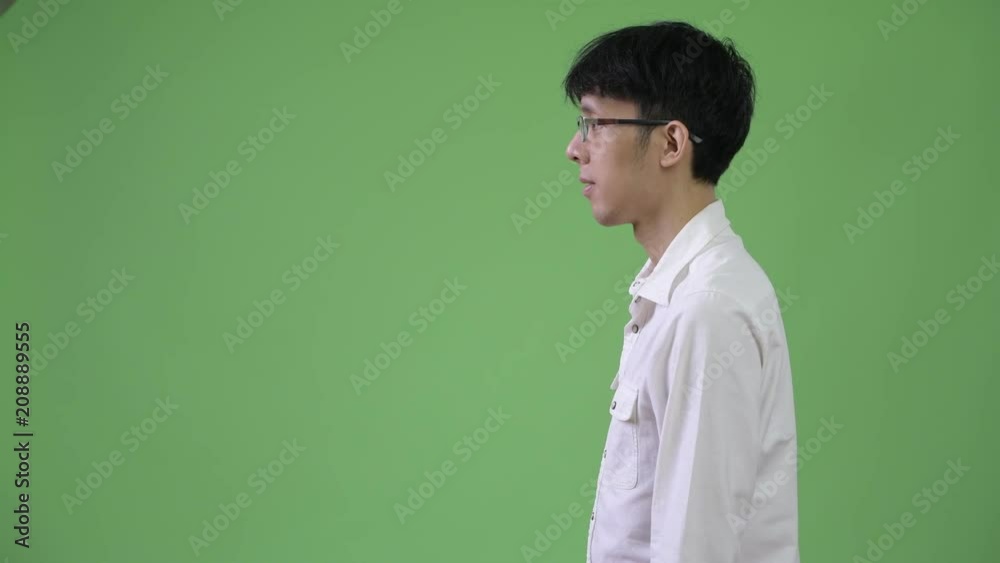 Profile view of young Asian businessman Profile view of young Asian businessman