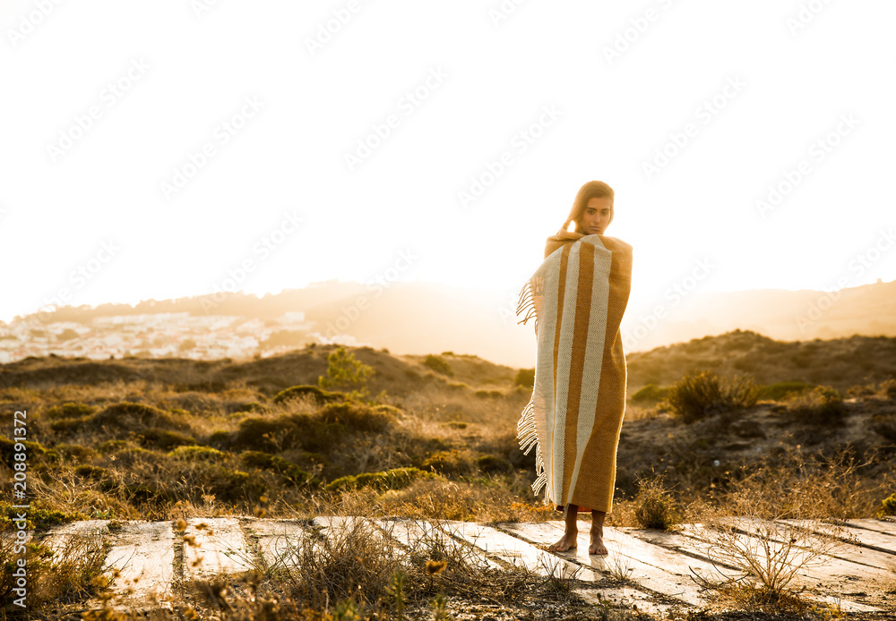 Naklejka premium Beautiful woman wrapped in a wool towel
