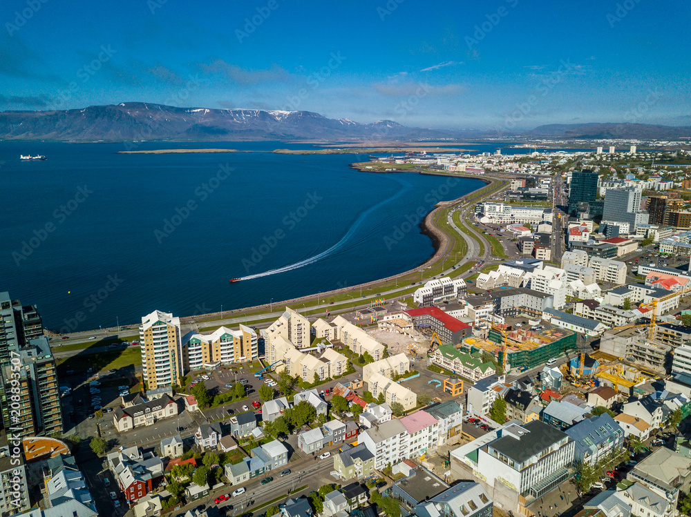 Reykjavik from yhe top. Iceland capital in summer sunny daytime. Aerial photo - obrazy, fototapety, plakaty 