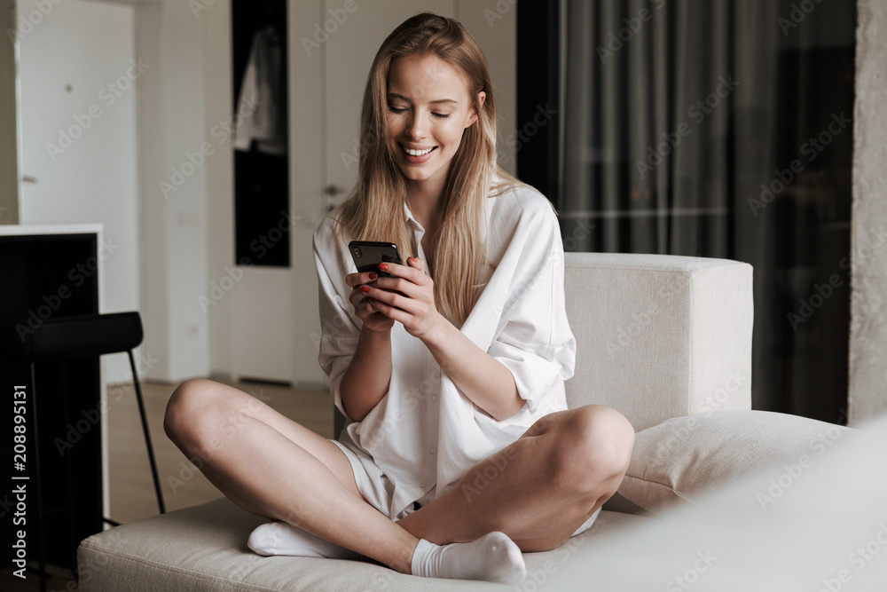 Cheerful young woman dressed in white shirt Cheerful young woman dressed in white shirt