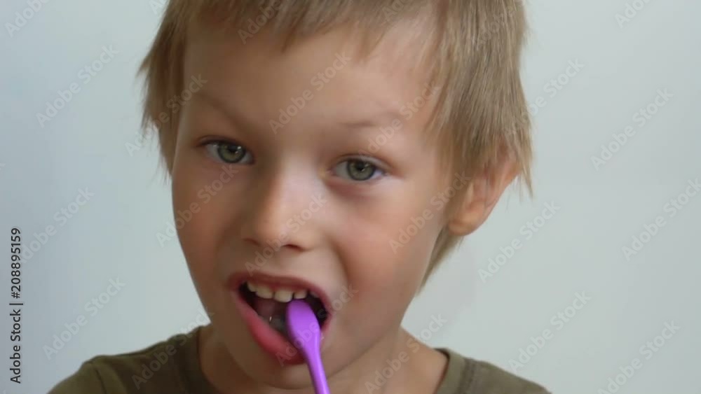 kid brushing his teeth close-up kid brushing his teeth close-up