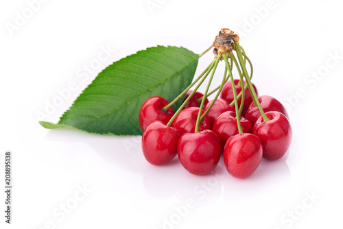 Cherry - Heap of berries isolated on white background.  A bunch of cherries with leaves attached