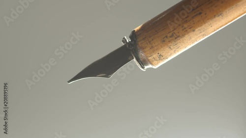 ink is dripping from the pen