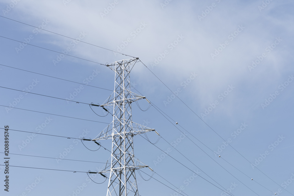 Blue Sky with white clouds and an electric tower with a cable connection Blue Sky with white clouds and an electric tower with a cable connection