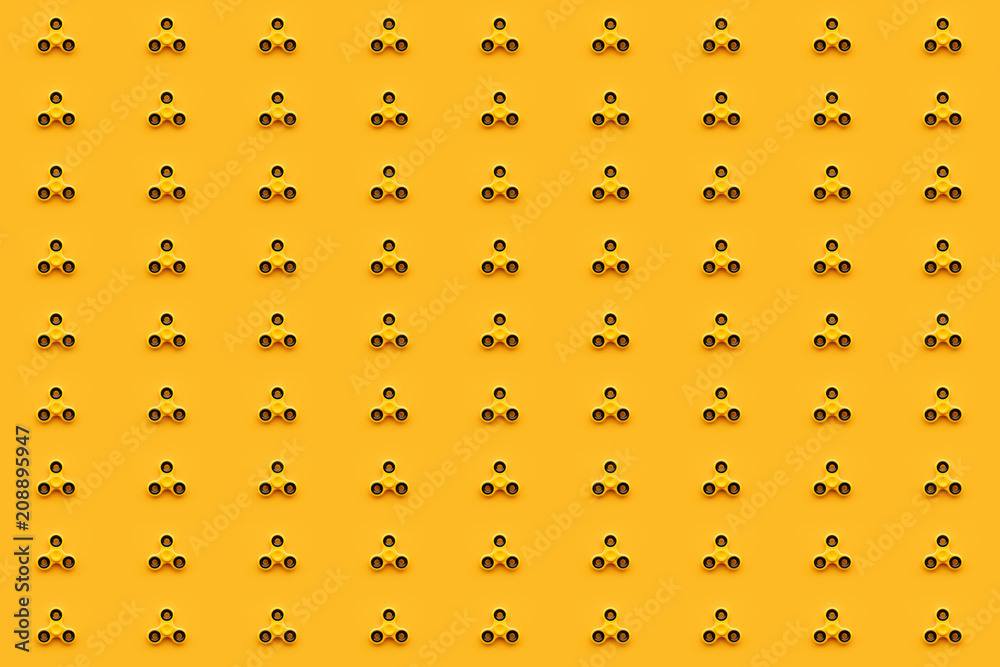 Seamless pattern background of yellow fidget spinner toy Seamless pattern background of yellow fidget spinner toy