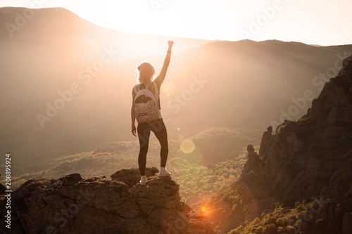 Beautiful woman on the top of mountain 