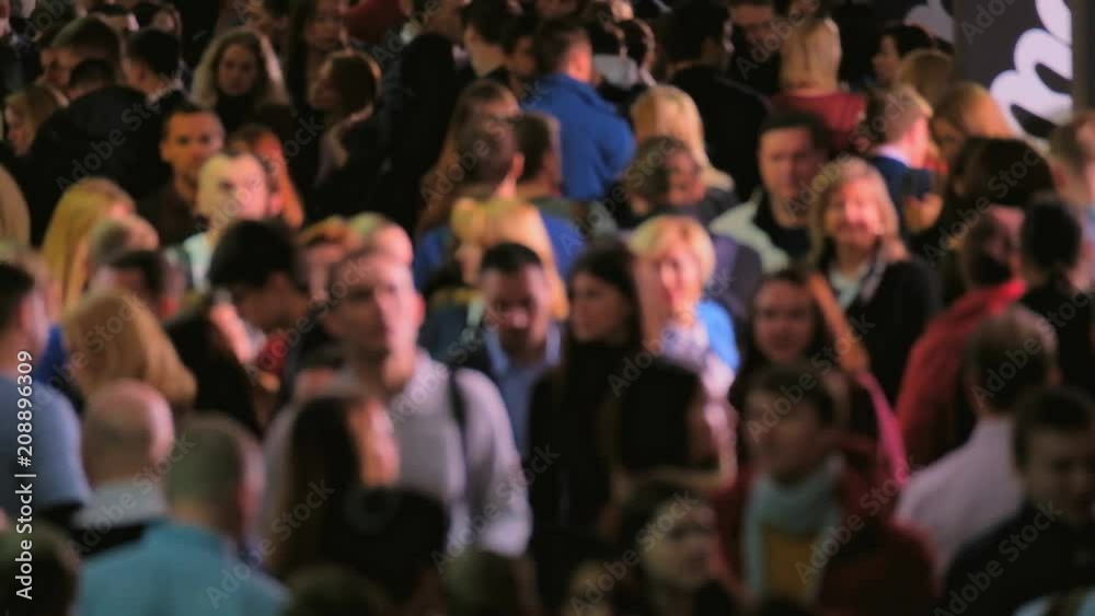Crowd of walking people walking indoors. Overpopulation concept Crowd of walking people walking indoors. Overpopulation concept