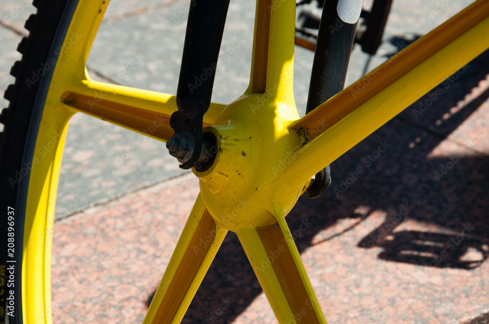Ukraine, Chernigov, May 27, 2018: cycling day, bike holiday, flash mob and bike ride in the city. Concept of a healthy lifestyle, family, sports. Bicycle axle, bicycle wheel close-up Ukraine, Chernigov, May 27, 2018: cycling day, bike holiday, flash mob and bike ride in the city. Concept of a healthy lifestyle, family, sports. Bicycle axle, bicycle wheel close-up