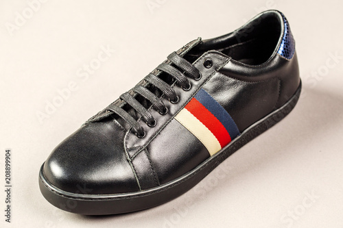 Black men shoes against gray background