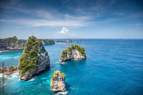 Aerial view of the small island of Nusa Batumategan and Nusa Batupadasan Island from the Atuh Rija Lima shrine on Nusa Penida Island near Bali, Indonesia.