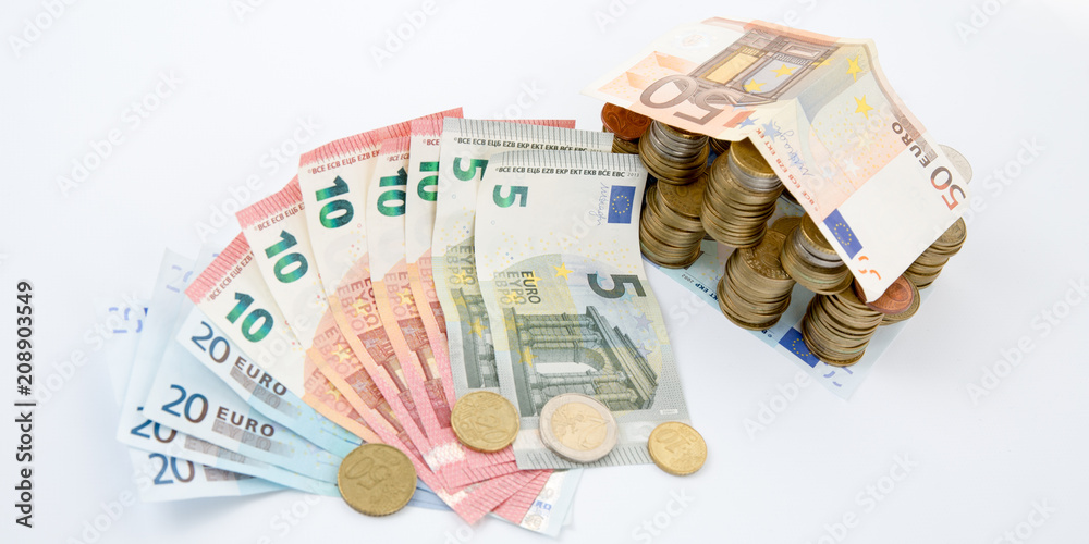 euro money household and financing concept home house made from Euro banknotes and coins euro money household and financing concept home house made from Euro banknotes and coins