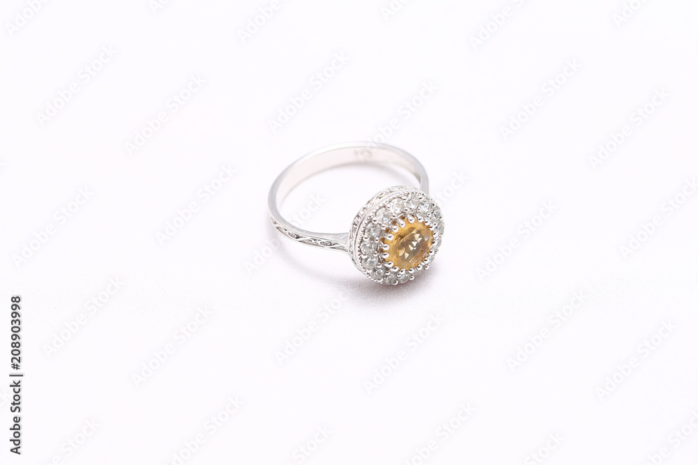 Yellow gem stone and diamond ring Yellow gem stone and diamond ring